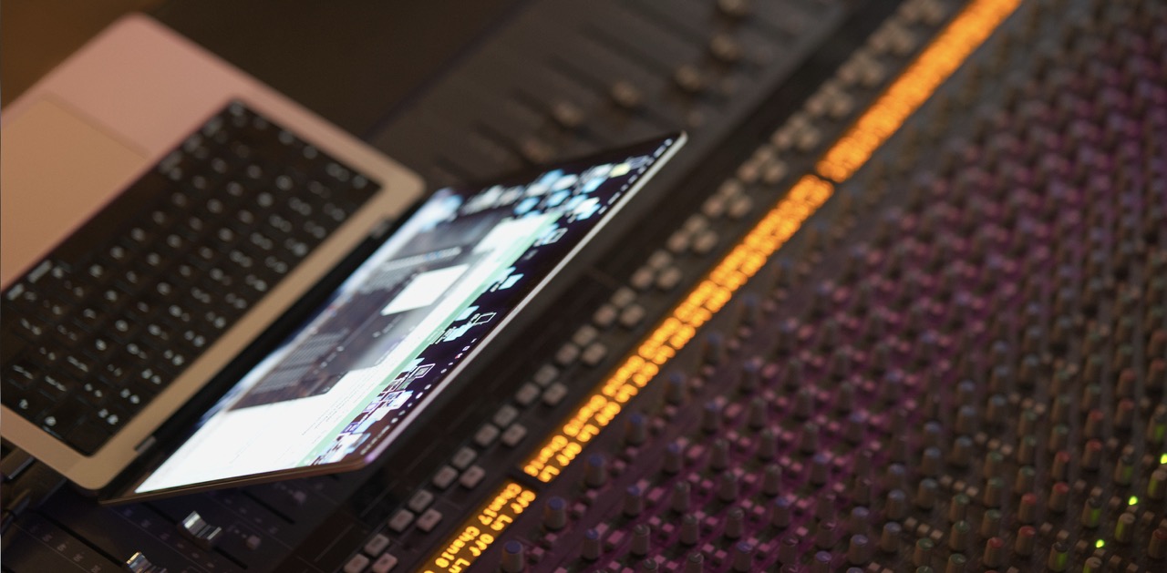 Mix session laptop on the studio desk